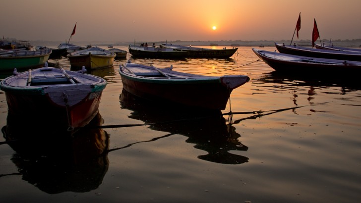 boats on the water at sunset
