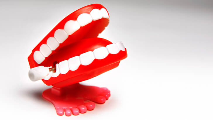 A set of red wind-up false teeth