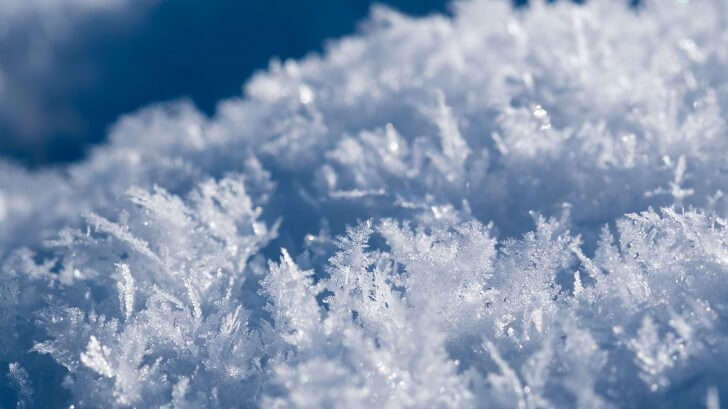 A close up picture of snow revealing its molecular structure
