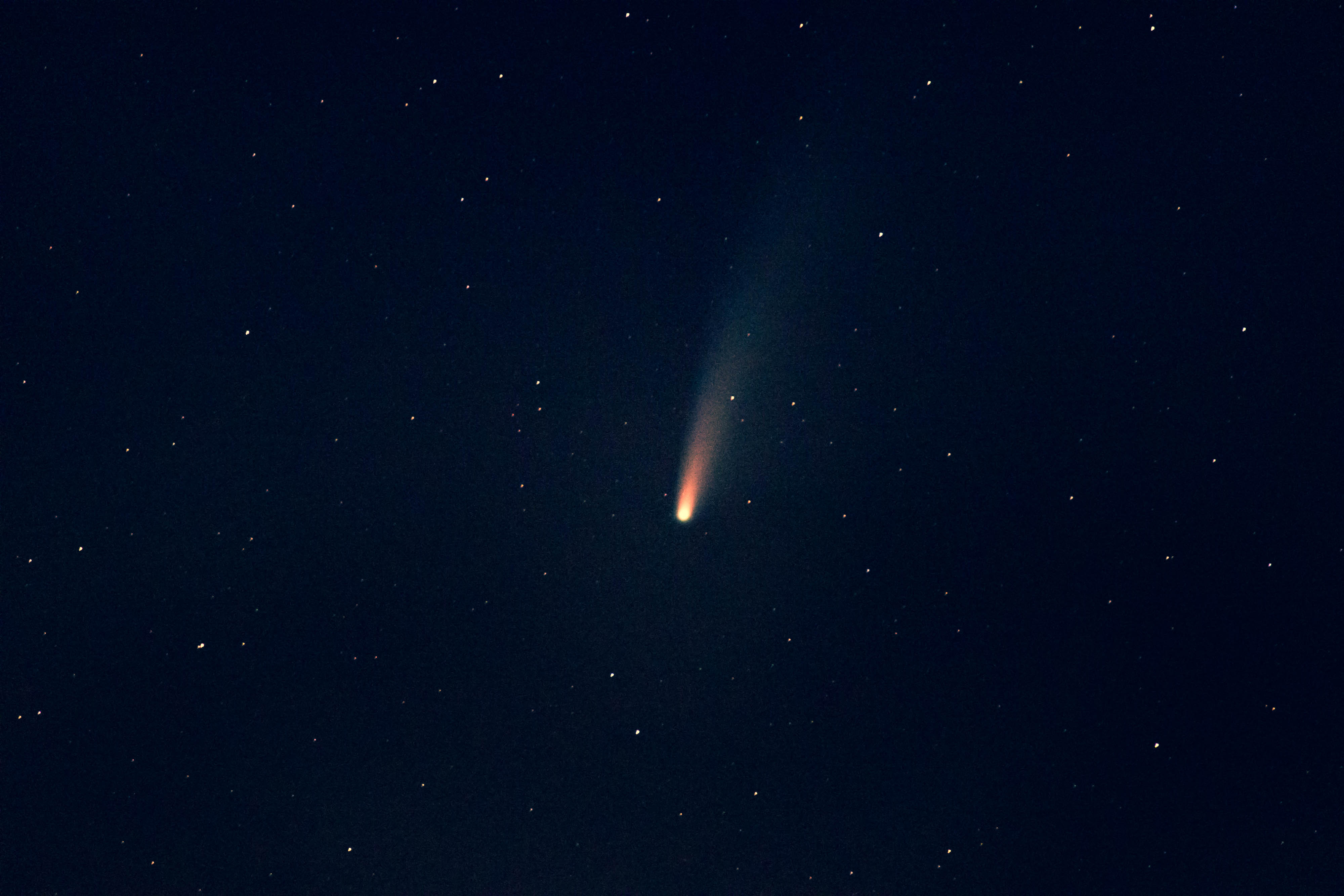 Comet falling through the night sky