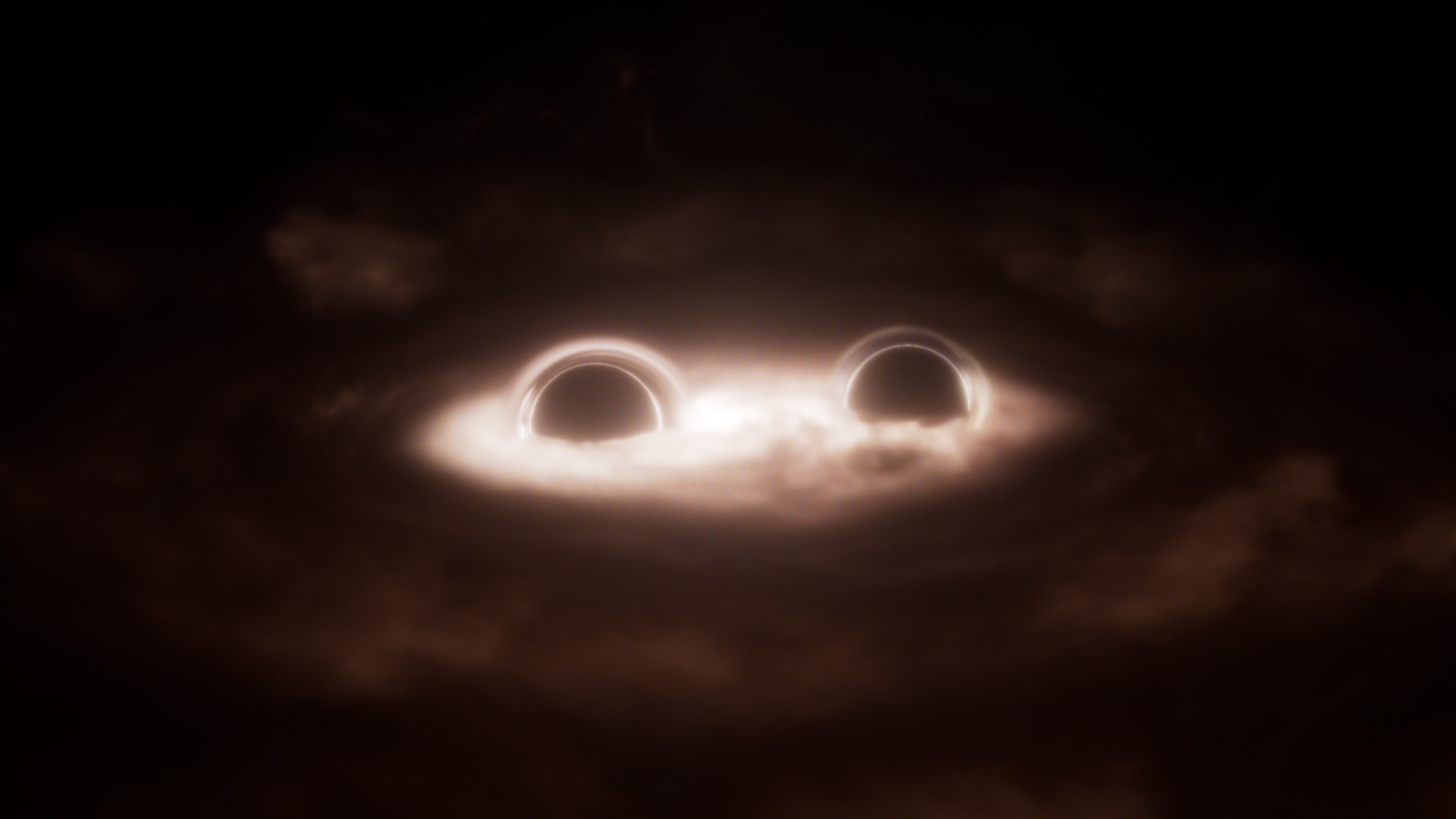 Two black holes spiral towards each other in a dance 